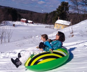 Photo of parent and child snow tubing-Winter Activities near Boston