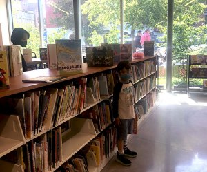 boy in the children's section at the greenpoint library