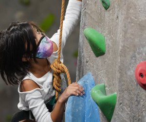 girl rock climbing At The Rock Club Affordable Westchester Summer Camps