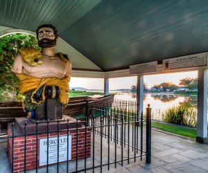 The figurehead of the Greek god Hercules, which once adorned the USS Ohio, now sits in a harborside pavilion in Stony Brook. Photo courtesy of the Ward Melville Heritage Organization