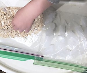 Turn a Highchair into a Baby Activity Center: Oatmeal and ice make sensory bags.