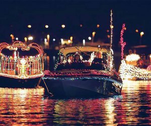 More than a dozen boats make their way down Freeport Village's iconic Nautical Mile at the Holiday Boat Parade. Photo courtesy of the event 