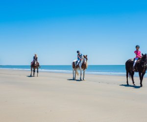 Horseback riding on the beach.