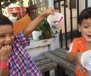 Things to do in NYC this summer: Two happy kids eating ice cream