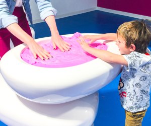Kids can explore the slime at the Sloomoo Institute in Chicago. Photo by Lauren LaRoche