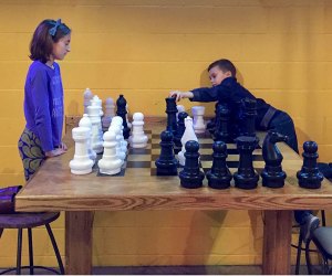 Image of children playing chess - Family-Friendly Breweries in Connecticut