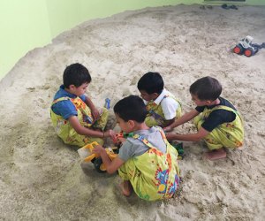 Play in the sand during a birthday part at The Great Story