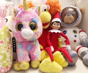 Elf on the Shelf hides among the stuffed animals