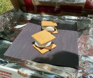 This solar oven science experiment offers one tasty reward: ooey, gooey s'mores.