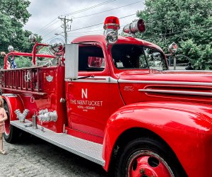 Image of child next to fire engine - Visiting Nantucket