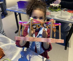 Photo of a child engaged in hands-on activities at Boston's Museum of Science.