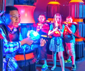 Play laser tag during a birthday party at iPlay America