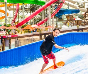 Photo of child on wave pool at indoor water park in VT.