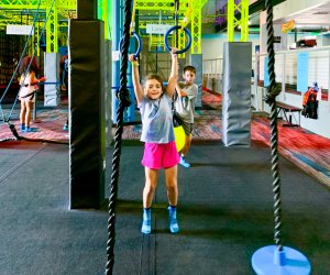 Kids can swing, climb, and jump their way through the ninja warrior course at ZavaZone. Photo by Jennifer Marino Walters