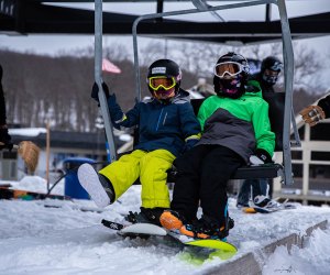 Big Boulder/Jack Frost snowboarders taking the chair lift Best Snowboarding NYC