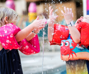 Ways to Keep Cool in a Heat Wave in Philly toddlers splashing in sprinkler