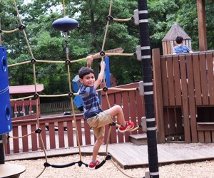 Climb the ropes at KidStreet Playground. Photo by  Kaylynn Chiarello Ebner