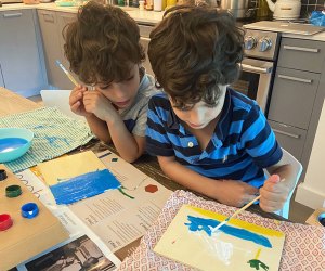 Kids can while away hours of a day with a set of watercolors and a stack of new paper for painting. Photo by Sara Marentette