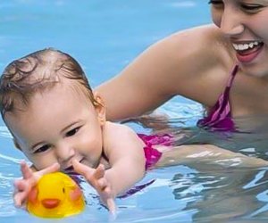 Baby swim classes are all about having fun and getting comfortable in the water. Photo courtesy of KIDS FIRST Swim Schools