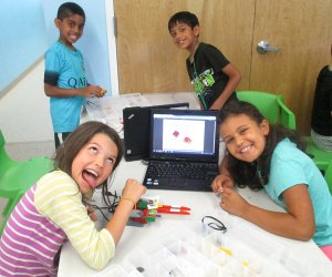 At L3 Academy young robotics campers build in a group using a design engineering process for feedback and evaluation