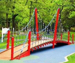 The climbing bridge at the LATCP playground at Eisenhower Park is a draw for kids of all ages. Photo courtesy of Let All The Children Play