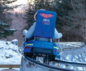 Cliffside Coaster riding down the hill on the coaster Things to Do in Lake Placid on a Winter Vacation Status message