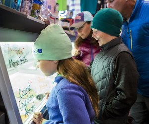 Emma's Lake Placid Creamy kids looking at treats  Things to Do in Lake Placid on a Winter Vacation Status message