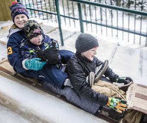 The 30-foot high Lake Placid Toboggan Chute sends riders down an ice-covered slide onto frozen Mirror Lake. 