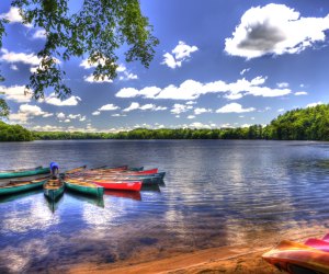 image of swimming lake near boston with canoes.