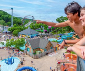 Photo of people looking at rides while visiting Lake Compound Amusement Park