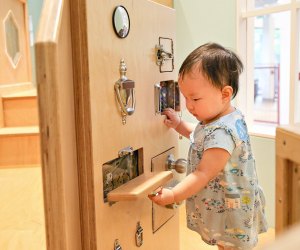 Discover the Latch Wall in the Brain Building Together space for 0-3 year olds. Photo courtesy of Discovery Museum