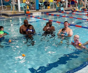 parents and babies in pool swim class