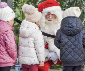 Visit with Santa for free at the Holiday Festival in Stony Brook Village. Photo courtesy of the Stony Brook Village