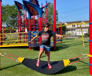 Newbridge Road Park Playground boy on a land surfboard balancing