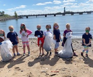 kids cleaning up the the shoreline liberty state park