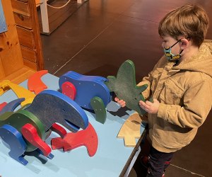 Little ones can create a dinosaur from a series of attachable parts. 