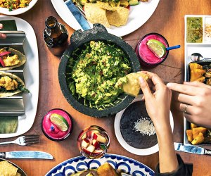 Dig into guac, beans and chips at Rosa Mexicano. Photo courtesy of the restaurant