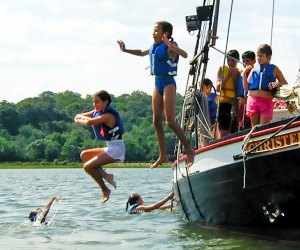 Weekend Fun: Lighthouse Celebration, Polish Town Fair, Jester Jim Take the wheel aboard the former oyster sloop Christeen in Oyster Bay. Photo courtesy of The WaterFront Center