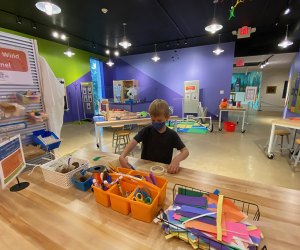 Boy at the Vertical Wind Tunnel Station at Spark!Lab at the Morris Museum