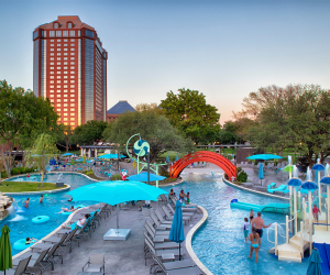 Discover an outdoor pool complex with slides, a lazy river, and dining options kids will love at the Hilton Anatole.