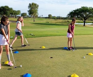 Introduce a beginner to the world of golf at To The Tee Golf's summer camp program. Photo courtesy of the club