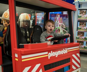 Cruise in the Playmobile Fire Truck during your trip to Toys R Us, one of several indoor places to play for free in New Jersey. Photo courtesy of American Dream Mall