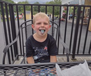Boy sticks out his tongue at DuBois Farms