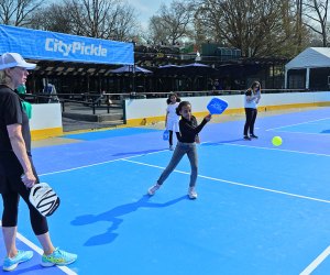 CityPickle pickleball in NYC: Close up of girl hitting a shot