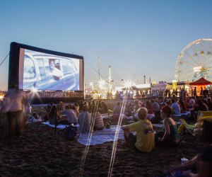 Enjoys a night with rides, food and a film at Coney Island Flicks on the Beach. Photo by Alexander Thompson/NYCGo