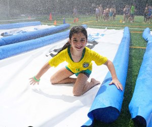 Splash and play at Asphalt Green's Sprinkler Day on Saturday, August 12. Photo courtesy of Asphalt Green