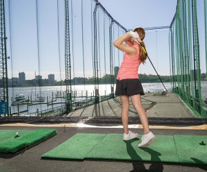 Swing into action with a golf summer camp at Chelsea Piers. Photo courtesy of Chelsea Piers