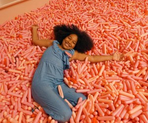 Diving into the sprinkle pool at the Museum of Ice Cream is a great way to cure rainy day blues. Photo by  Jody Mercier