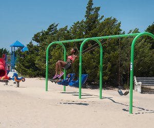 Kids play on a brach playground