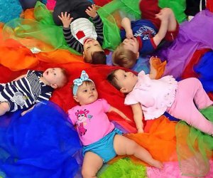 Babies experience colorful, sensory play at A Kids Gym.